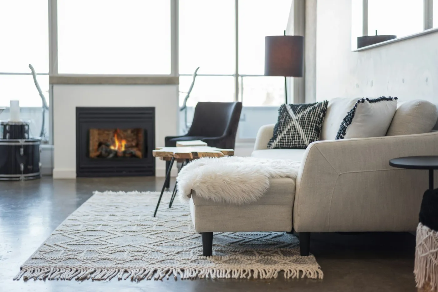 Modern gas fireplace burning in a bright living room